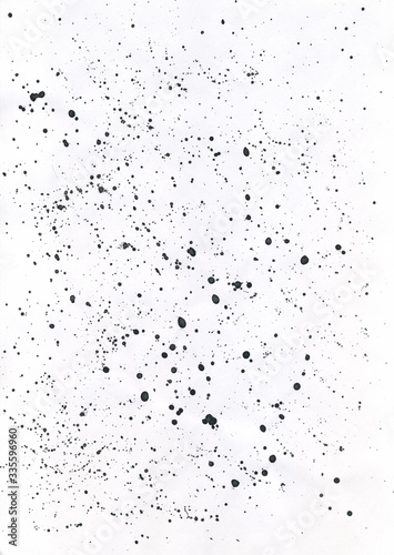 Ink splatter splashes isolated on white background. Hand drawn ink texture backdrop.