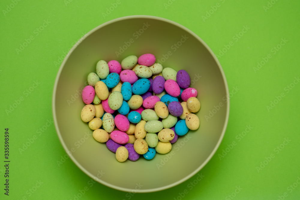 Assortment of speckled eggs in green bowl Assortment of speckled eggs in green bowl