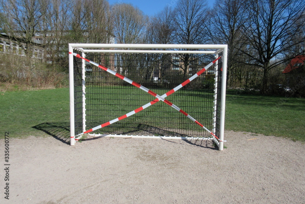 Soccer goal blocked due to corona crisis on a playground in a public green area in Hamburg, Germany
