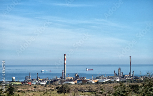 refinery on the seashore, the general plan. oil and gas petrochemical industrial, Refinery factory oil storage tank and pipeline steel.