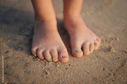 Baby legs on the sand beach