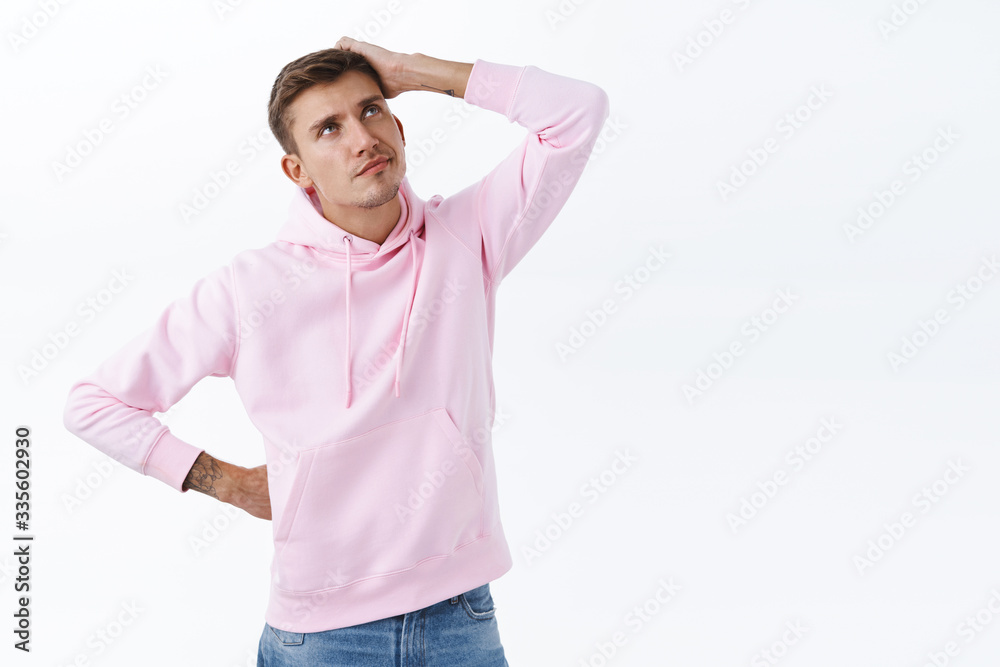 Portrait of indecisive unsure handsome blond man cant make decision, scratching head and looking up thoughtful, make-up idea, dont know what do, making choice standing white background Portrait of indecisive unsure handsome blond man cant make decision, scratching head and looking up thoughtful, make-up idea, dont know what do, making choice standing white background