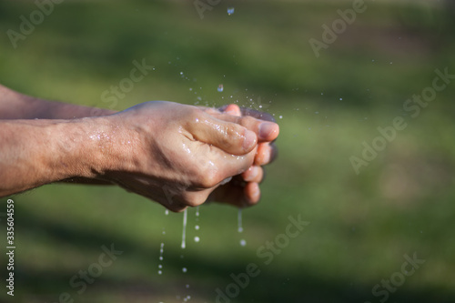 Man's hands are washed with soap. Disinfection prevention of viral diseases