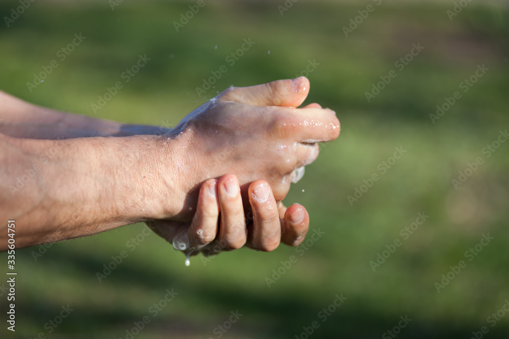 Man's hands are washed with soap. Disinfection prevention of viral diseases Man's hands are washed with soap. Disinfection prevention of viral diseases