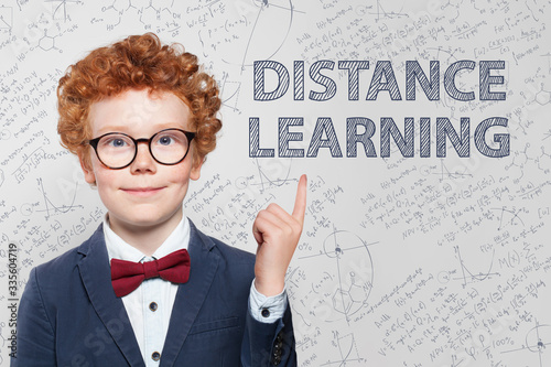 Distance education and pointing schoolboy kid on white background