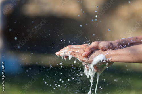 Man s hands are washed with soap. Disinfection prevention of viral diseases