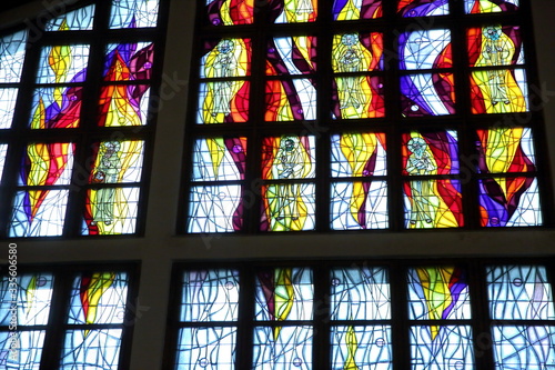 The whole window in the church is filled with stained glass with figures in flames.