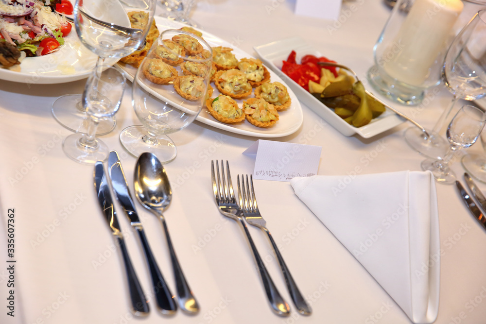 Stylish table setting in the restaurant for special guests. Stylish table setting in the restaurant for special guests.