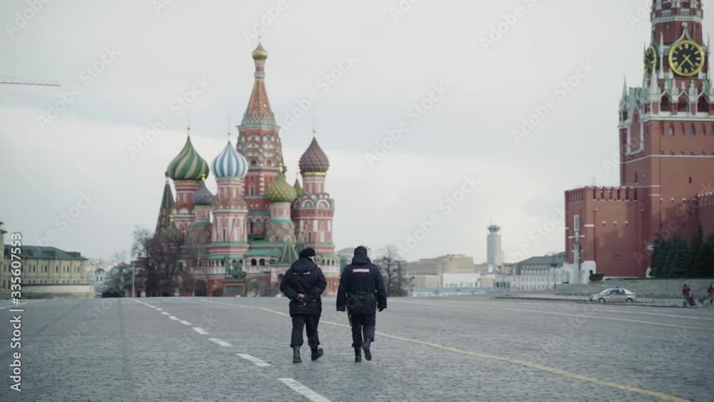 Two Police officers walk on Red Square in Moscow closed for quarantine, kremlin