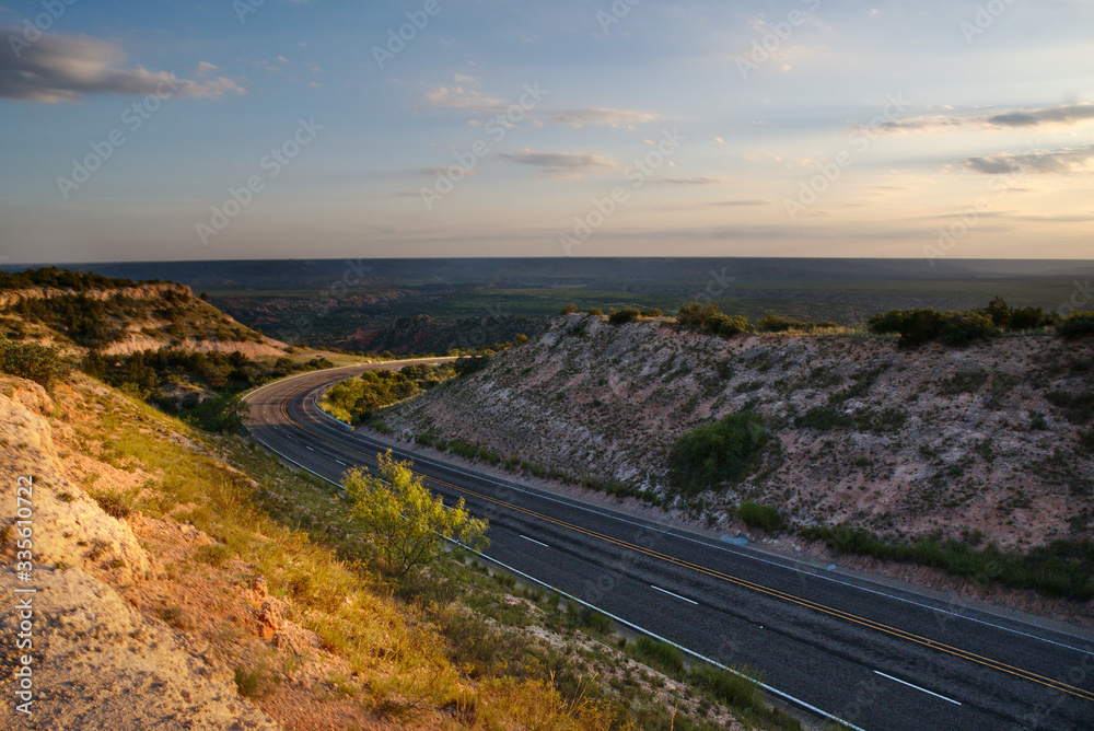 A road winds through West Texas near Palu Duro Canyon A road winds through West Texas near Palu Duro Canyon
