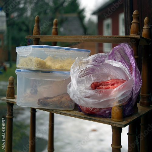  stand with food in olastic bags and containers photo