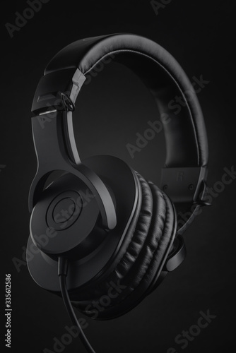 black headphones on a black background