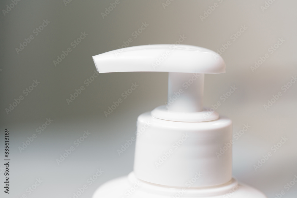 white dispenser with liquid soap white dispenser with liquid soap