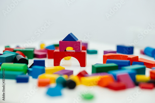 Multi-colored blocks of a wooden constructor. Concept of development of preschool children.