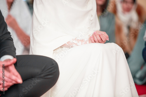 Praying arabian people in the mosque. Islamic wedding photo