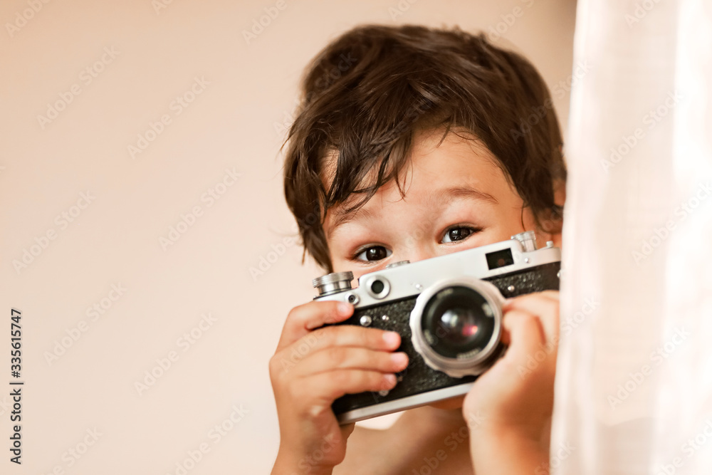 A boy of eastern appearance with a camera A boy of eastern appearance with a camera