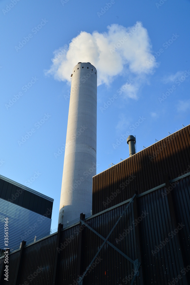 industrial plant with smoking chimney with blue sky industrial plant with smoking chimney with blue sky
