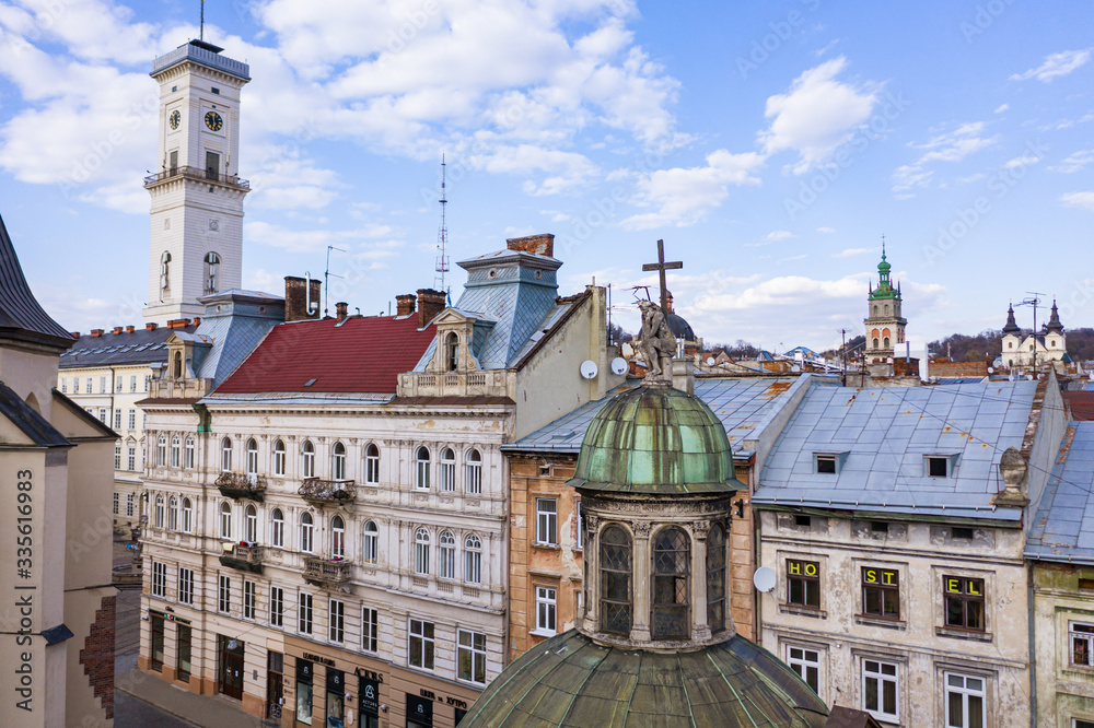 Obraz premium View on Boim Chapel near Latin cathedral and Lviv city hall from drone