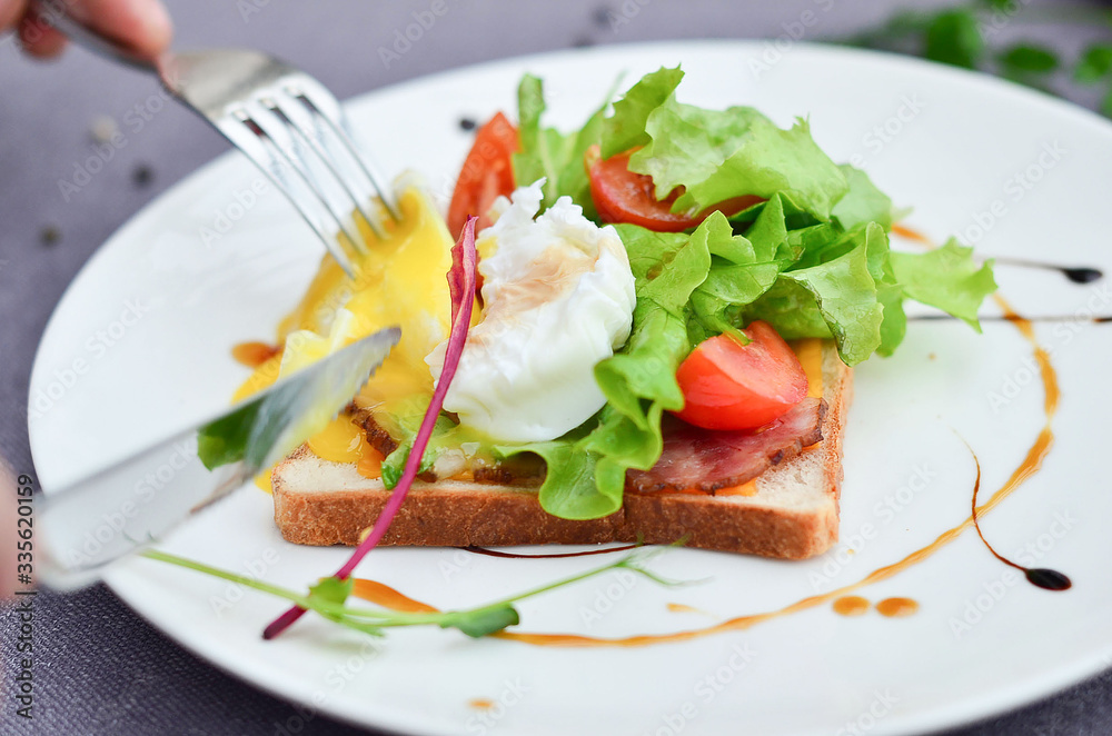 food, poached an egg on toast with vegetables on a plate food, poached an egg on toast with vegetables on a plate