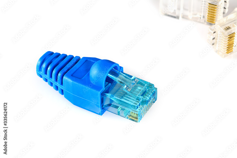 Blue RJ45 connector and blue boot for crimping rj-45 plugs for home Internet connection. Home network concept, macro close up isolated on white background. Blue RJ45 connector and blue boot for crimping rj-45 plugs for home Internet connection. Home network concept, macro close up isolated on white background.