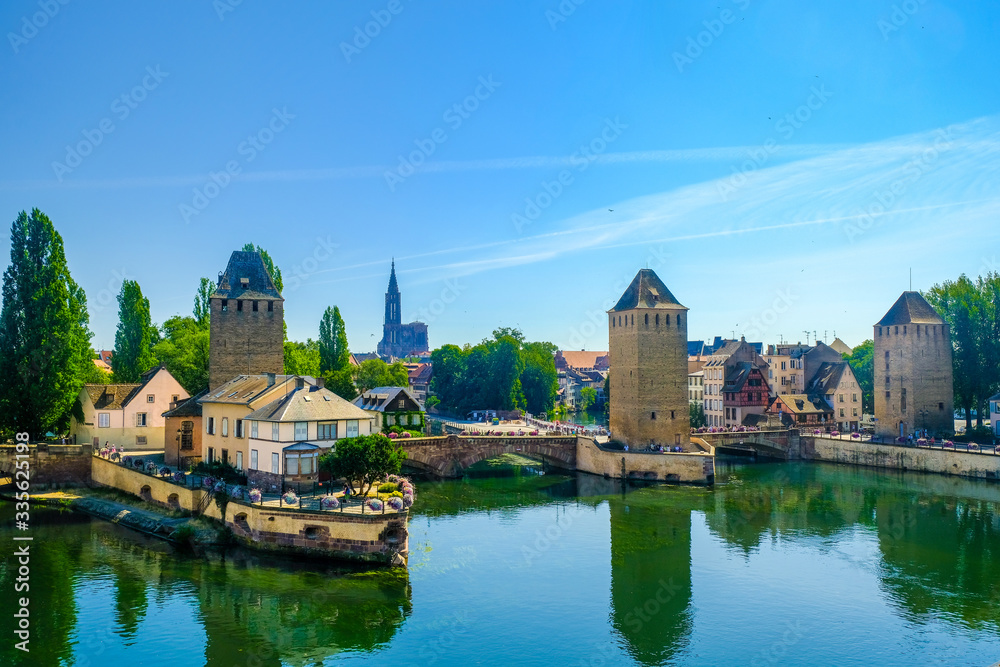 Strasbourg, France, Alsace. Canals and medieval bridges Ponts Couverts with towers.