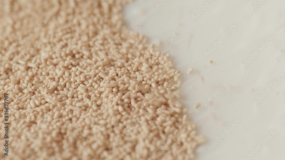 spilling pouring dry instant yeast falling extreme macro