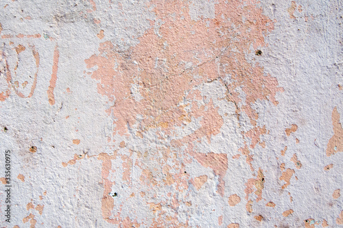 Background of old cracked pastel color paint on cement wall.