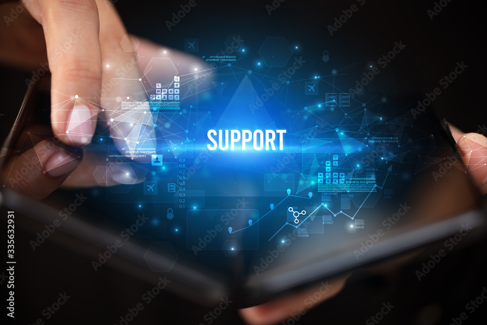 Fototapeta premium Businessman holding a foldable smartphone with SUPPORT inscription, business concept