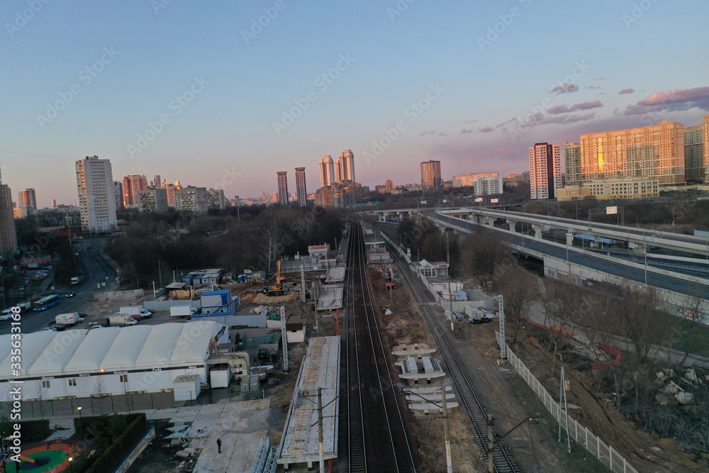 panoramic views from the drone of the railway and the highway of the big city