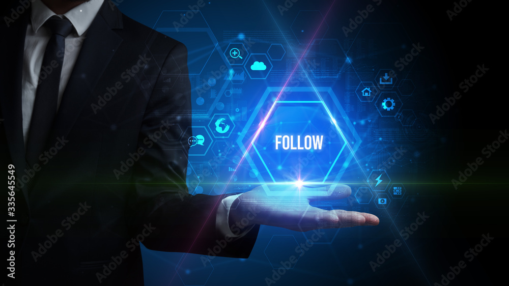 Man hand holding FOLLOW inscription, social media concept Man hand holding FOLLOW inscription, social media concept