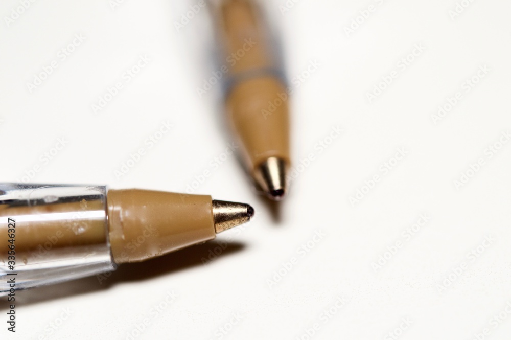 Ball-point pens in macro view and isolated on white background Ball-point pens in macro view and isolated on white background