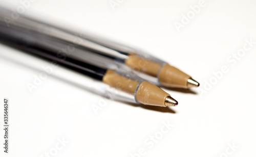 Ball-point pens in macro view and isolated on white background