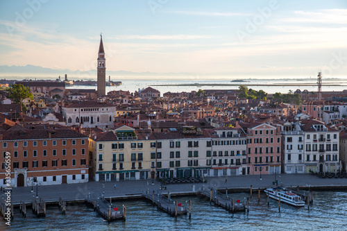 Venice, Italy - Houses on the Venice Canal and Alps in the morning light
