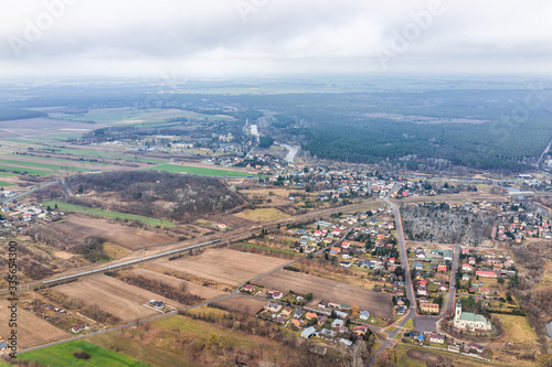 Nowy Dwor, Poland high angle view from window near airport with rural winter brown landscape countryside near Warsaw and river by farm fields