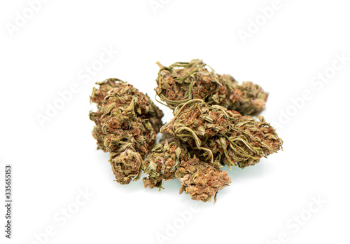 Several perfectly died green cannabis buds isolated on white background. Closeup of marijauna buds on white background.