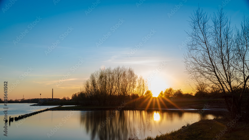 Sunset during spring at Rhine riverbank