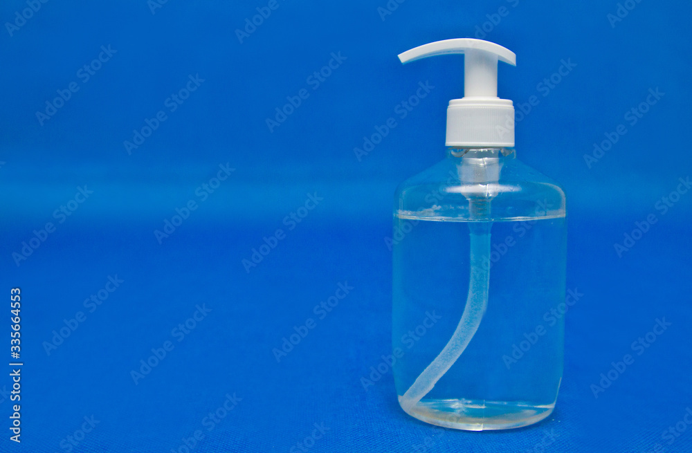 Antiseptic bottle, latex gloves, face mask on blue background, for coronavirus prevention Antiseptic bottle, latex gloves, face mask on blue background, for coronavirus prevention