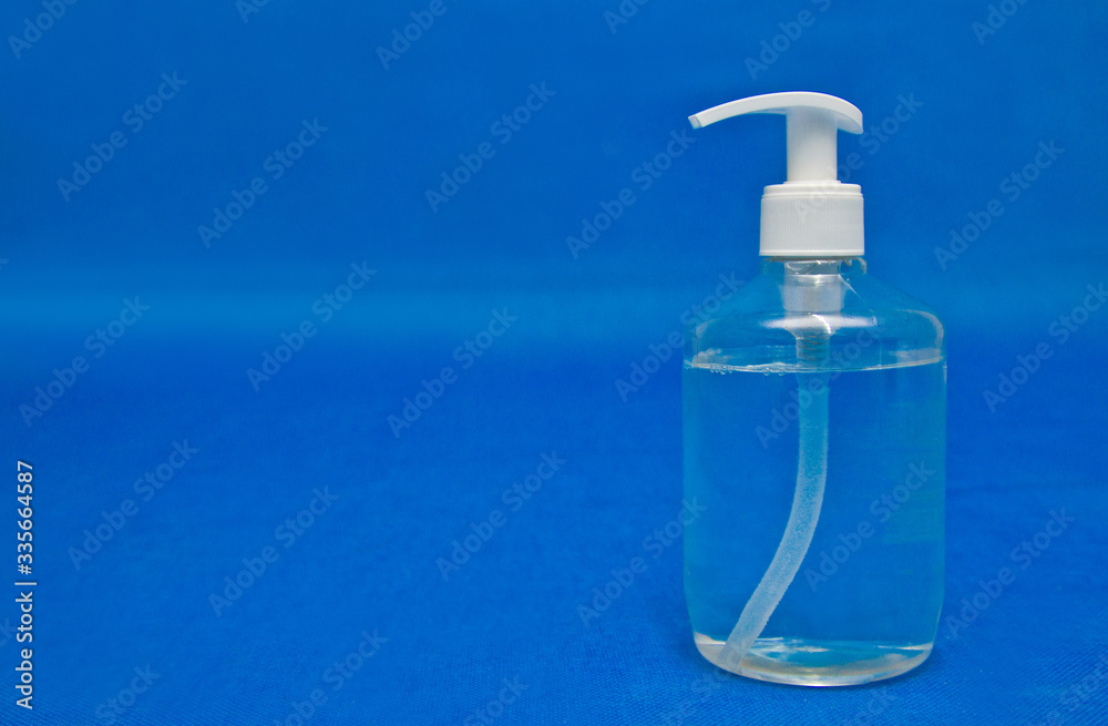 Antiseptic bottle, latex gloves, face mask on blue background, for coronavirus prevention Antiseptic bottle, latex gloves, face mask on blue background, for coronavirus prevention