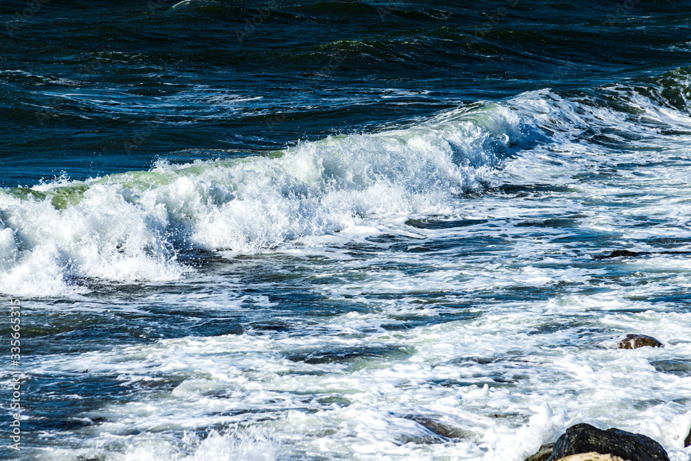 Splashing sea waves. Blue wavy sea water