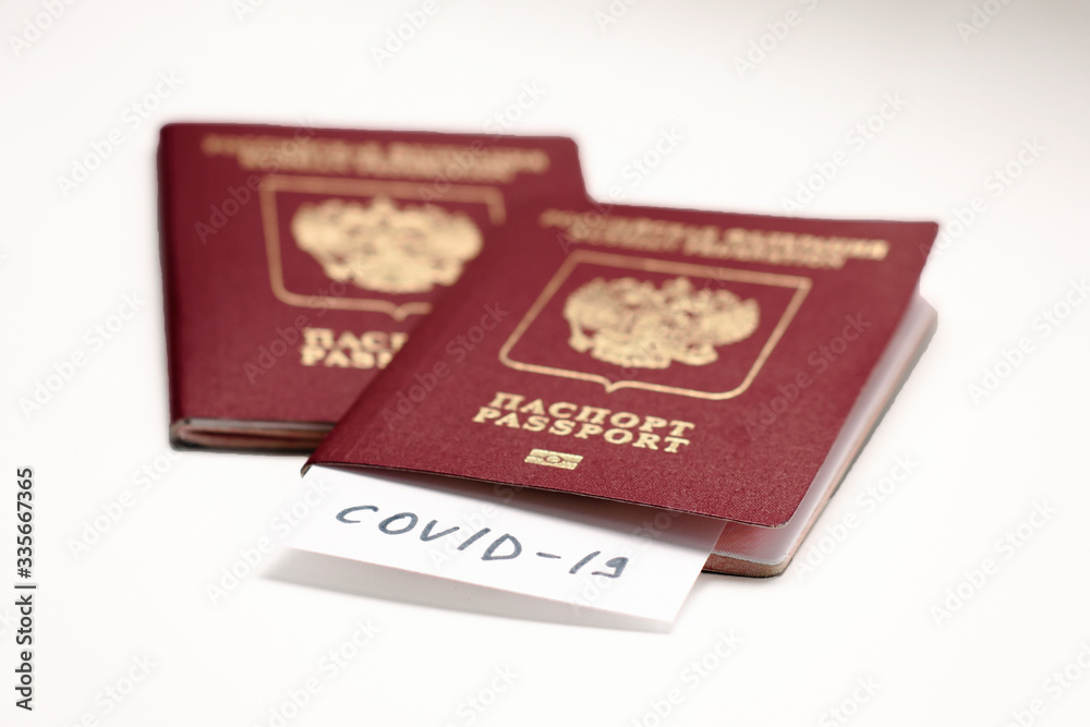 Coronavirus COVID-19 and tourism. Passport, COVID-19 inscription for travel. Quarantine. Restriction for tourists. Covid19 Corona virus disease danger pandemic spread worldwide global Coronavirus COVID-19 and tourism. Passport, COVID-19 inscription for travel. Quarantine. Restriction for tourists. Covid19 Corona virus disease danger pandemic spread worldwide global