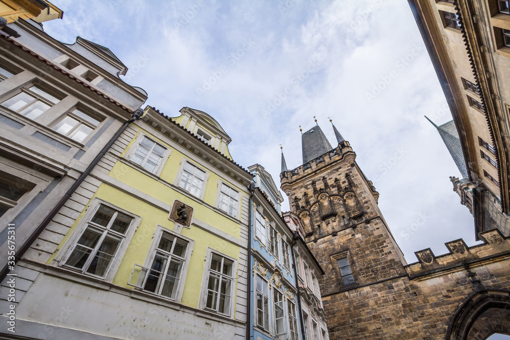 Picture of the lesser town bridge tower of Charles Bridge, also called malostranska mostecka vez in Prague, Czech Republic, surrounded by narrow medieval streets and houses
