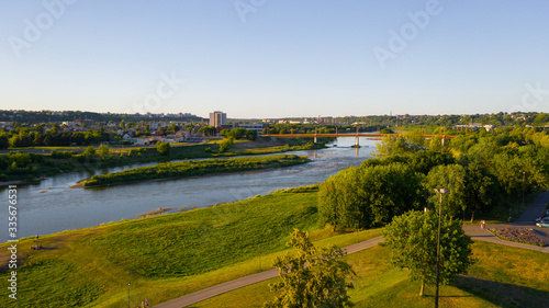 Beautiful panoramic aerial view photo from flying drone to the Nemunas River and Petras Vileišis Bridge. Kaunas, Lithuania (series)