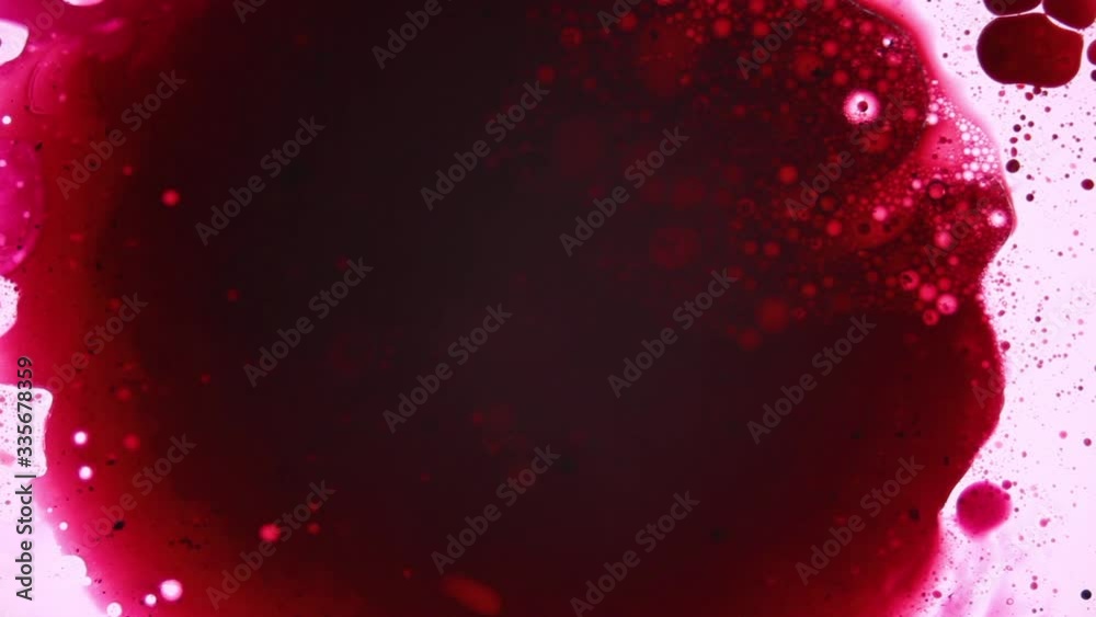 Red bloody moving stain with bubbles and particles Red bloody moving stain with bubbles and particles