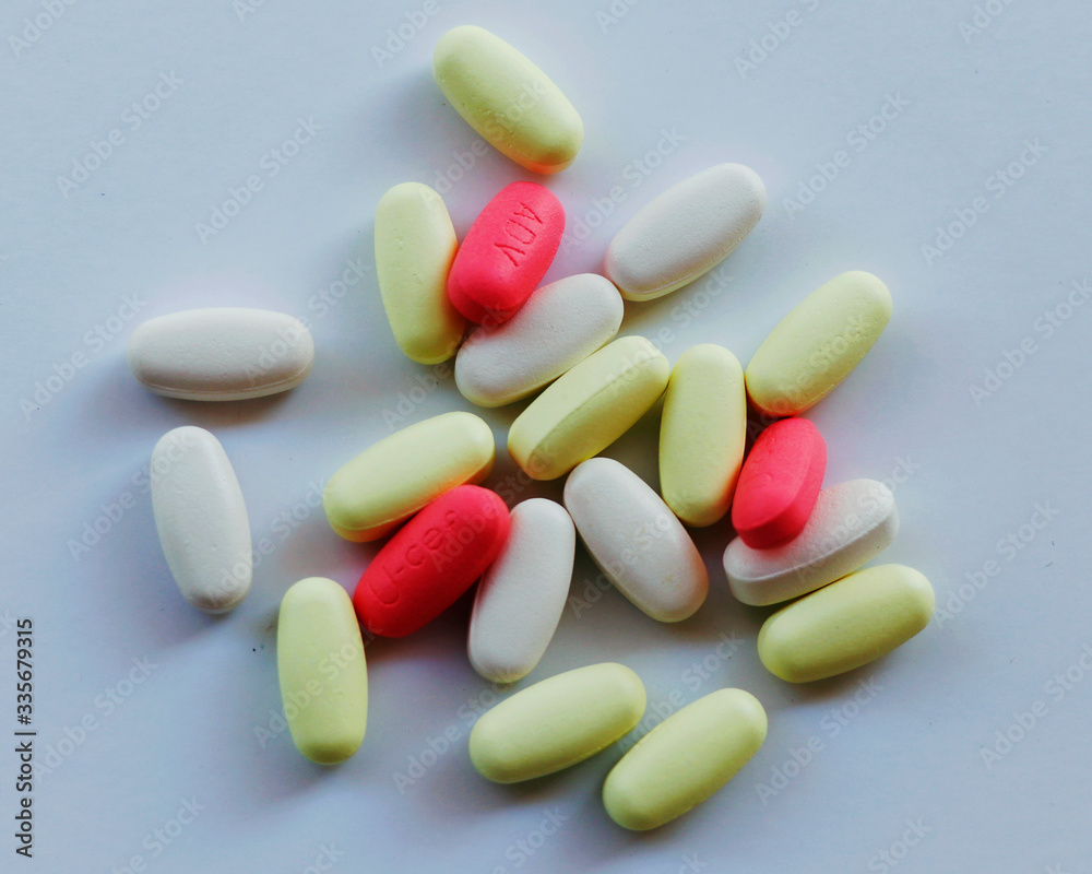 differents kinds of tablets and medicine on a white background differents kinds of tablets and medicine on a white background