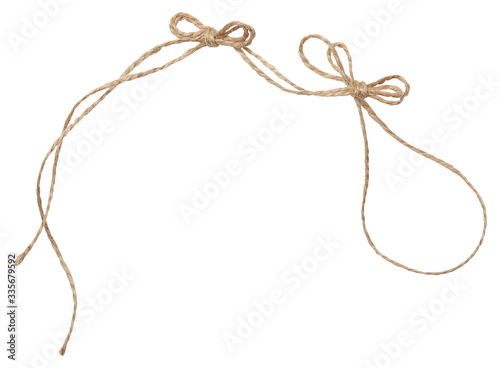 Fototapeta Naklejka Na Ścianę i Meble -  Rope wrap with bow isolated on white. Isolated twine made of natural materials. 
