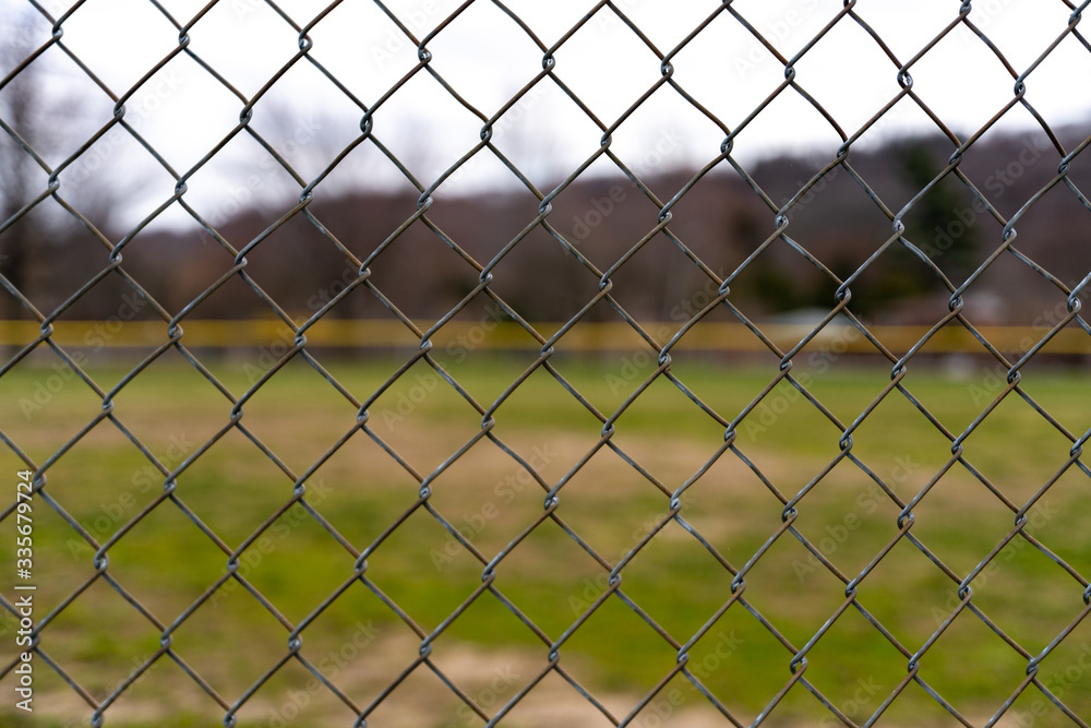 Isolated Fence Pattern with Field and Grass in the Background Isolated Fence Pattern with Field and Grass in the Background