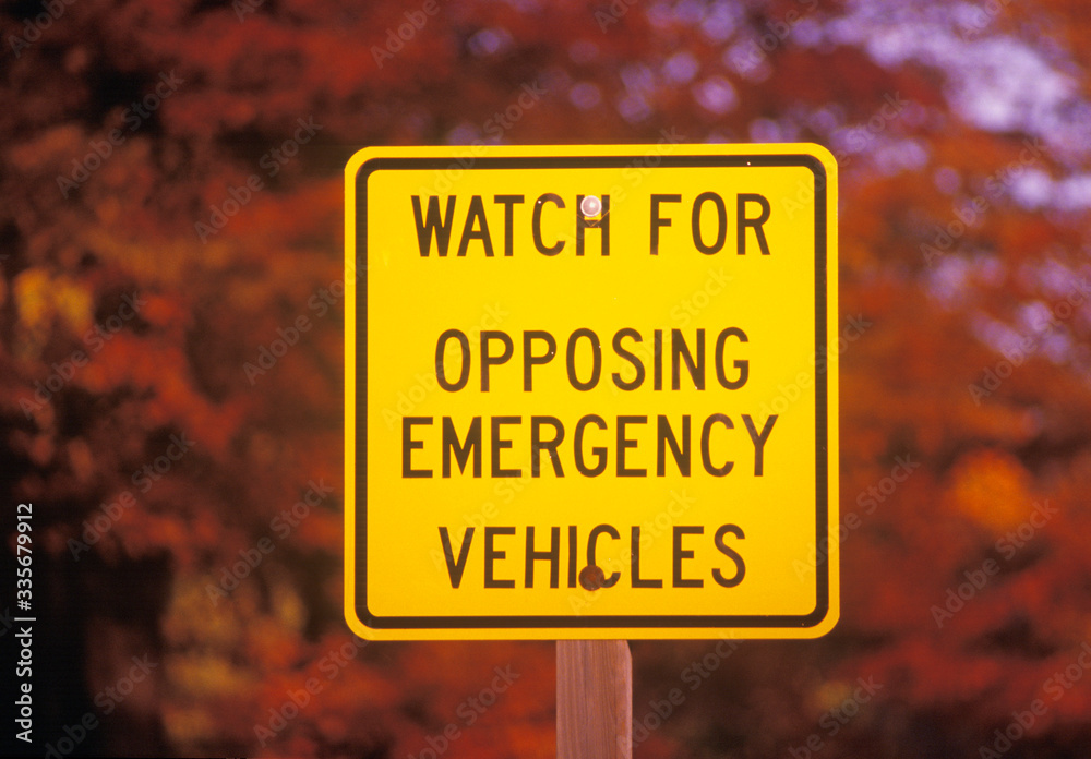 A sign that reads ÒWatch for opposing emergency vehiclesÓ A sign that reads ÒWatch for opposing emergency vehiclesÓ