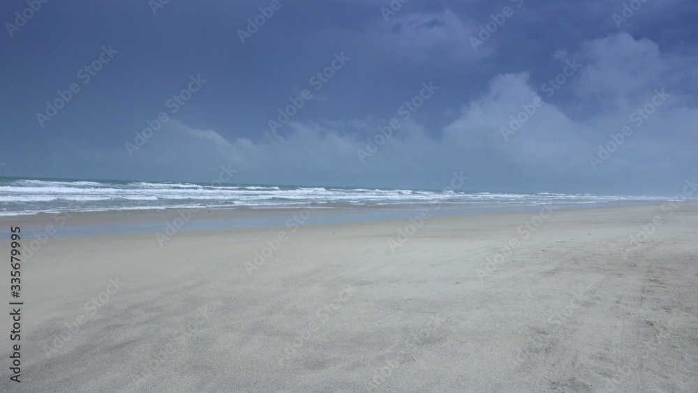 Empty sandy beach on a rainy day - Atlantic ocean