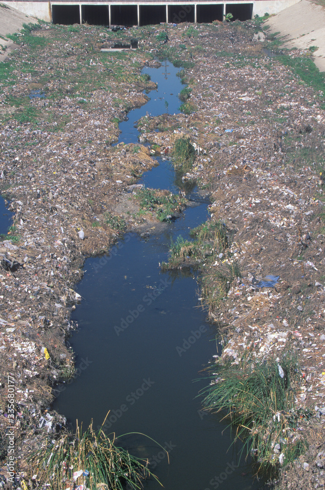 An undesignated urban dump on the Los Angeles River in Compton, California