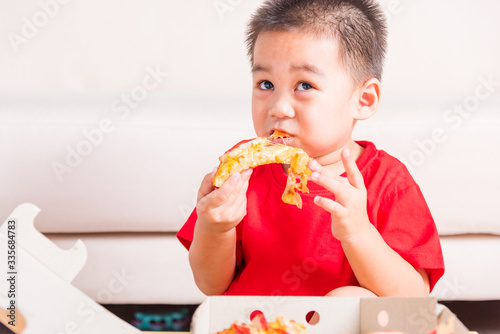 Little Child enjoying eating Delivery